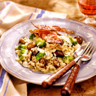 Paddenstoelenrisotto met broccoli en Parmaham